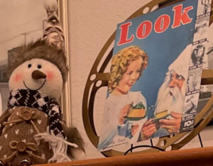 Detail of a stuffed snowman and Look magazine cover with Shirley Template and Saint Nicholas