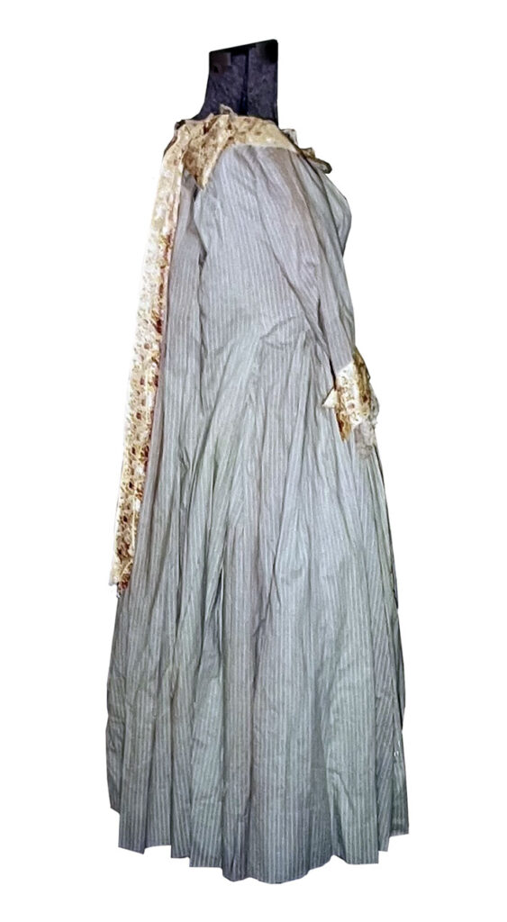 Back side view of an unknown MGM costume, cotton green & white striped gingham full-length dress
