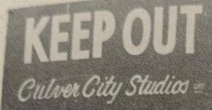 Partial view of a Culver Studios sign that says Keep Out Culver City Studios