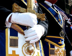 Detail image of the dress uniforms and sword of a masonic ceremony