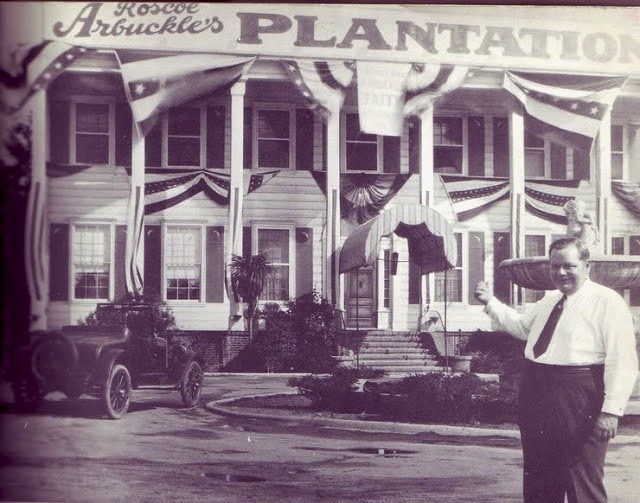 Roscoe “Fatty” Arbuckle in front of Plantantion Café