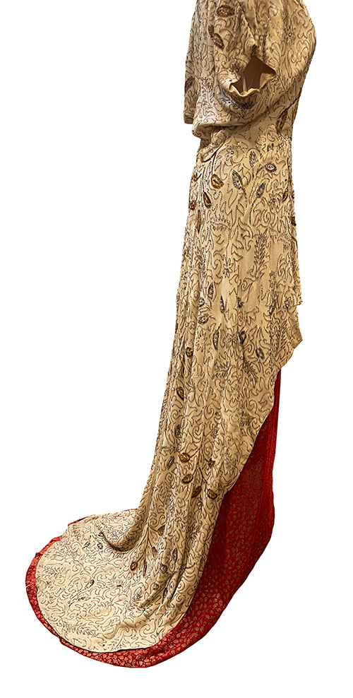 Unknown MGM dress costumer in gold and red, side view