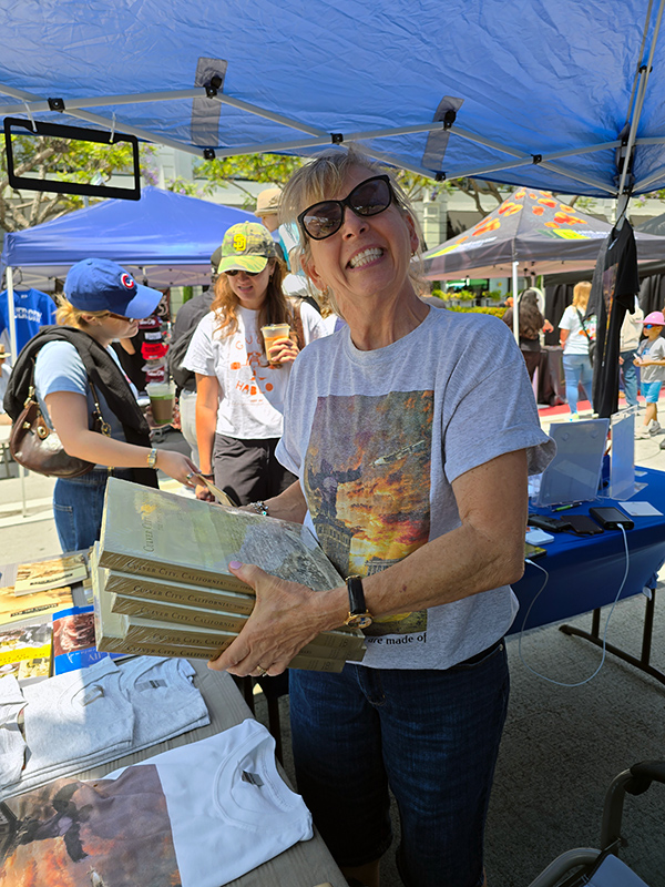 Working the Culver City Historical Society booth is Costumes Chair Valerie Cameron