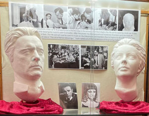 Picture of the Fall 2026 exhibit display case and picture of Liz Taylor getting her life cast done.