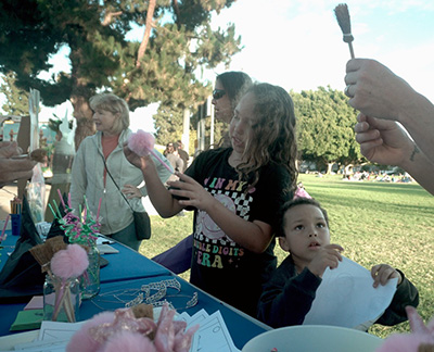 kids and parents checking out the CCHS table
